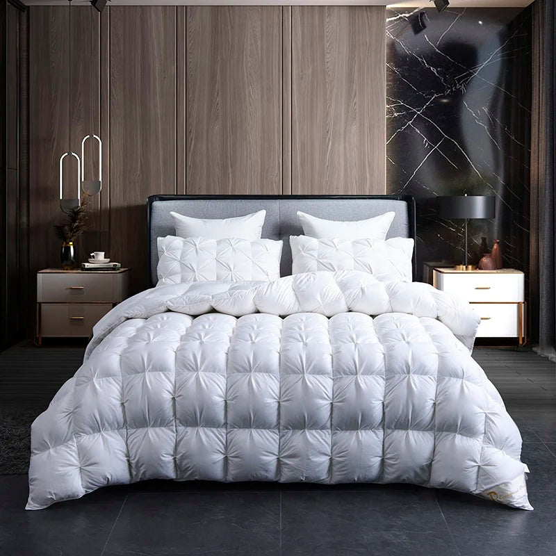 A luxurious white goose down duvet with a cotton cover displayed on a bed in a modern bedroom.