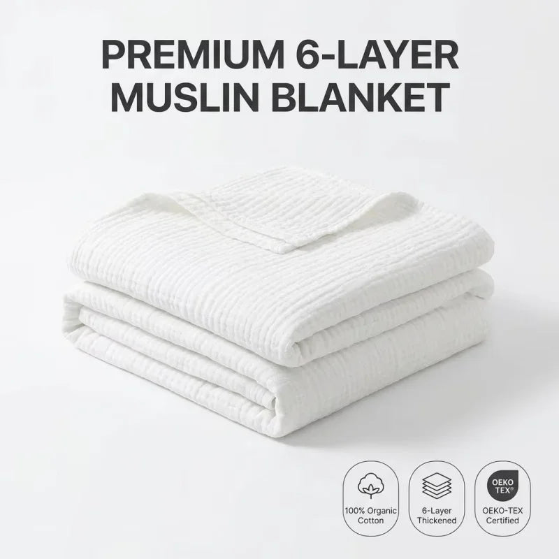 A stack of white premium 6-layer muslin blankets with an OEKO-TEX certified label.