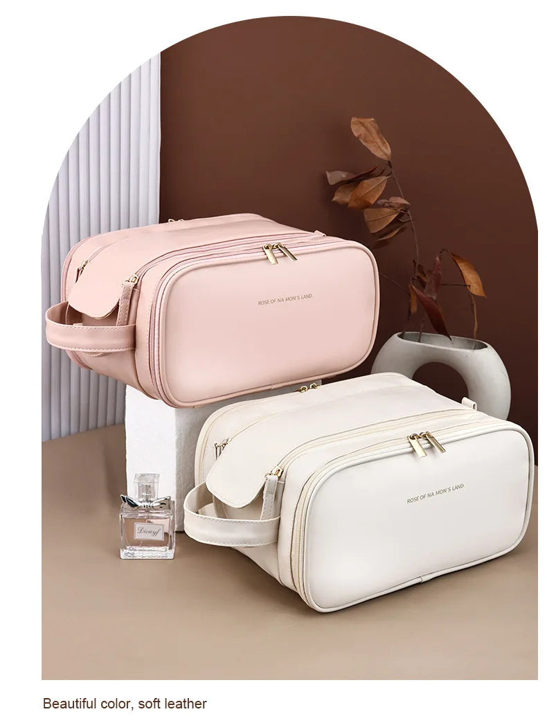 A light pink cosmetic bag and a white cosmetic bag are displayed against a brown background with some dried leaves.