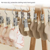 A display of fully upgraded double-head dipping stainless steel clothespins with hooks for laundry.