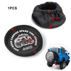 A set of off-road tire covers for a 4WD vehicle, including a spare tire cover and a black fabric item.