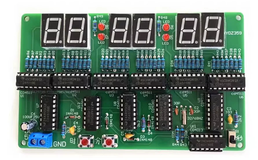 A green electronic circuit board featuring multiple 8-digit LED displays and various components for a digital clock DIY kit.