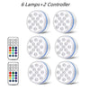 Six submersible LED pool lights and two controllers for underwater lighting.