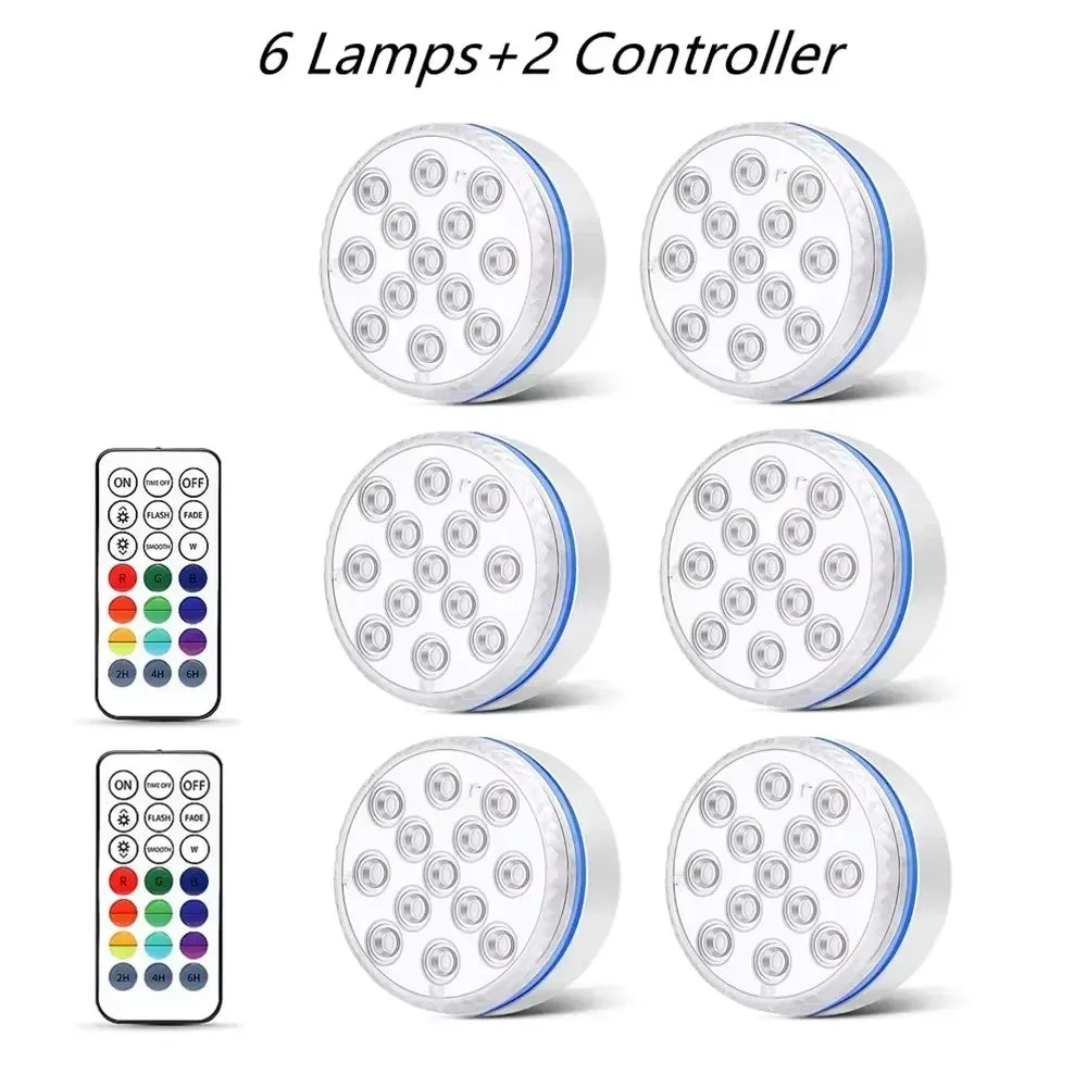 Six submersible LED pool lights and two controllers for underwater lighting.