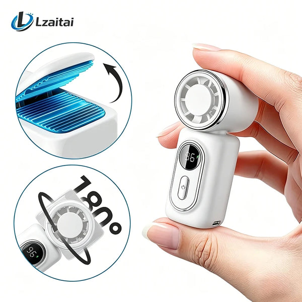 A hand holds a white portable mini fan with a clip and LED display, showing its opened mechanism and temperature reading.