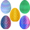 A collection of four 3D printed articulated dragon egg figurines in various colors including blue, purple, yellow, and green.
