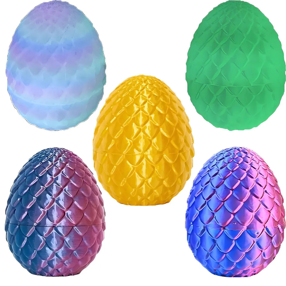 A collection of four 3D printed articulated dragon egg figurines in various colors including blue, purple, yellow, and green.