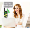 A mother and two children are playing with walkie talkies indoors, enjoying fun in home.