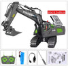 A remote controlled excavator toy set with a yellow and black body, hydraulic arm, and control transmitter.