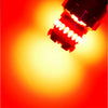 A close-up view of a pair of bright LED bulbs designed for brake, reverse, and parking lights.
