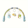 A colorful baby crib mobile featuring animal shapes hanging from a curved wooden arch.