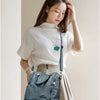 Vintage-Inspired Crossbody Bag with Roomy Interior
