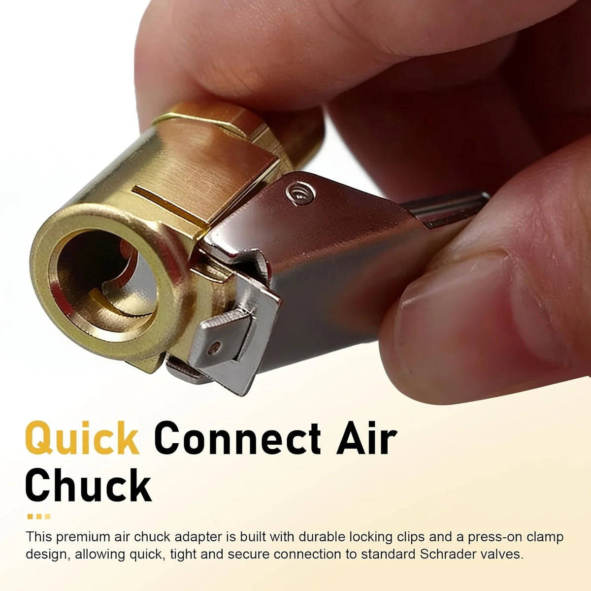 A hand holds a brass air chuck adapter designed for connecting to standard Schrader valves.