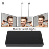 A black trifold LED mirror with light, showing a man's reflection.