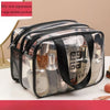 A clear plastic travel toiletry bag with a mesh pocket and double pockets for separating wet and dry items.
