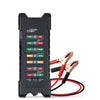 A black car battery tester device with LED indicators and red cables is shown.