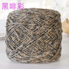 A ball of metallic silver shimmer crochet yarn used for knitting and macrame projects.