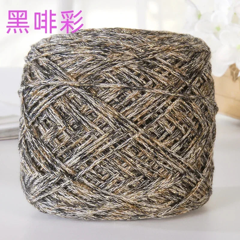 A ball of metallic silver shimmer crochet yarn used for knitting and macrame projects.