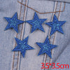 Set of five blue glitter star iron-on embroidered patches on denim fabric