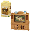 A wooden toy set featuring a television and furniture, part of the Sylvanian Families Forest Friends gift set.