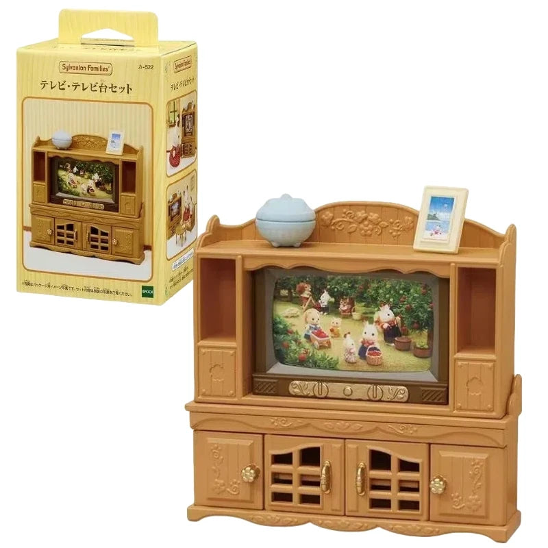 A wooden toy set featuring a television and furniture, part of the Sylvanian Families Forest Friends gift set.