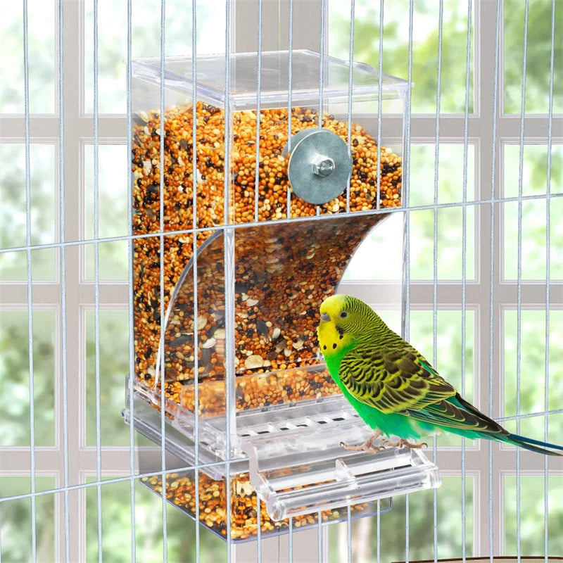 An acrylic bird feeder and waterer filled with seeds, viewed through a wire cage.