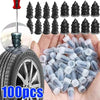 A hand holds a pile of clear rubber tire puncture nails for self-repair kits.