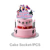 A pink birthday cake decorated with K-Pop themed figurines and a banner on top.
