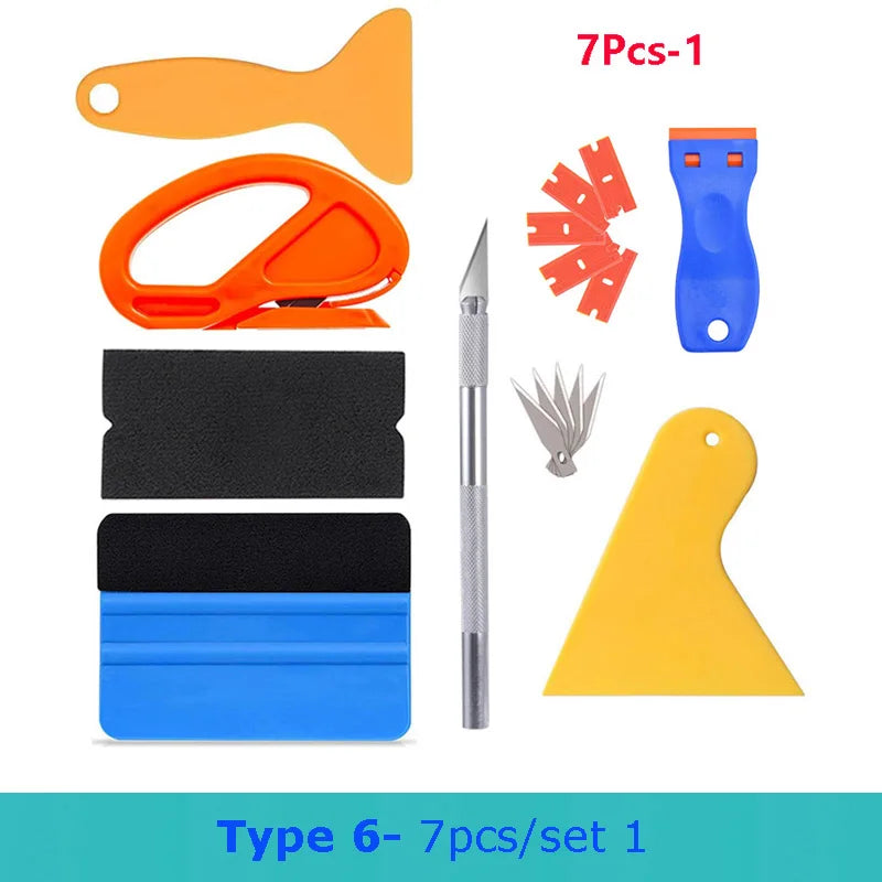 A set of seven vinyl wrap and film application tools including a spatula, orange tool, black and blue film pieces, a knife, a