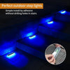 Blue LED step lights installed adhesively on stairs and paths.