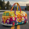 A yellow quilted travel duffle bag with purple and pink stitching rests on an asphalt road.
