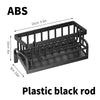 Black plastic rod sink organizer with a drainage tray for kitchen use