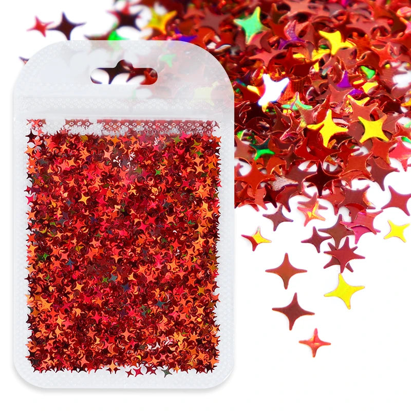 A white plastic container filled with red and orange holographic star sequins.