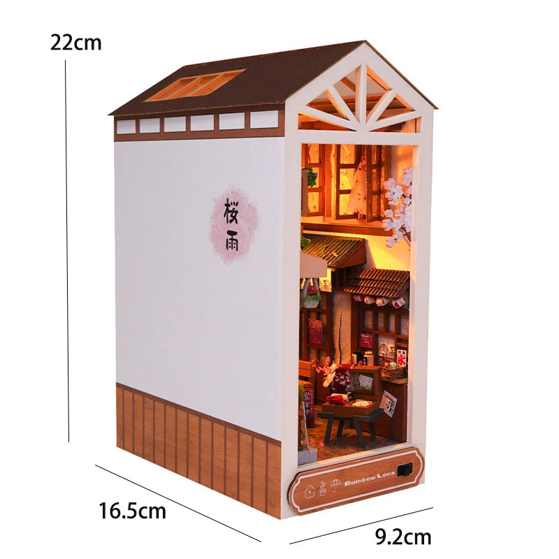 A miniature DIY book nook kit depicting a detailed room scene with wooden accents and interior display.