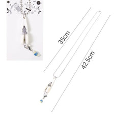 Silver precision mini scissors with a protective cover displayed against a white background.