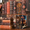 A display of books and a DIY book nook kit featuring an enchanted owl theme with intricate details and LED lighting.