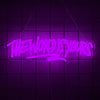 A neon sign spelling out THE WORLD IS YOURS in bright purple light against a dark grid background.