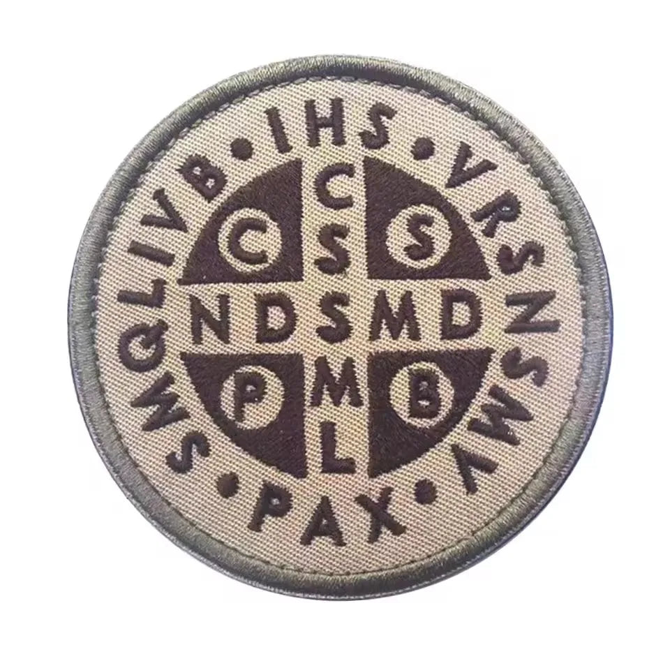Embroidered patch featuring the Knights Templar cross shield design in dark brown on a light fabric background.