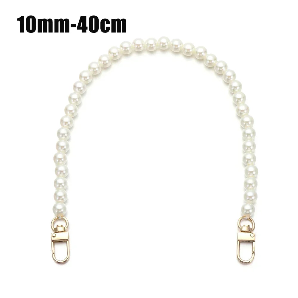 A strand of small, round white pearls on a delicate chain strap.