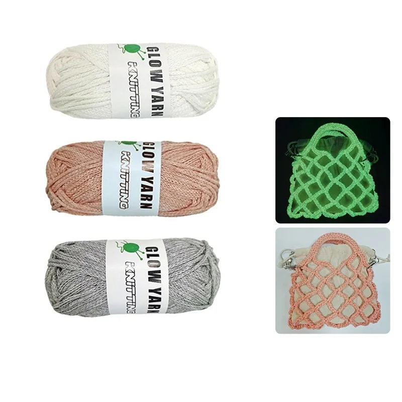 Three skeins of glow-in-the-dark polyester yarn for knitting and crochet in white, pink, and gray.