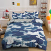 A duvet cover set featuring a blue and white camouflage pattern displayed on a bed.