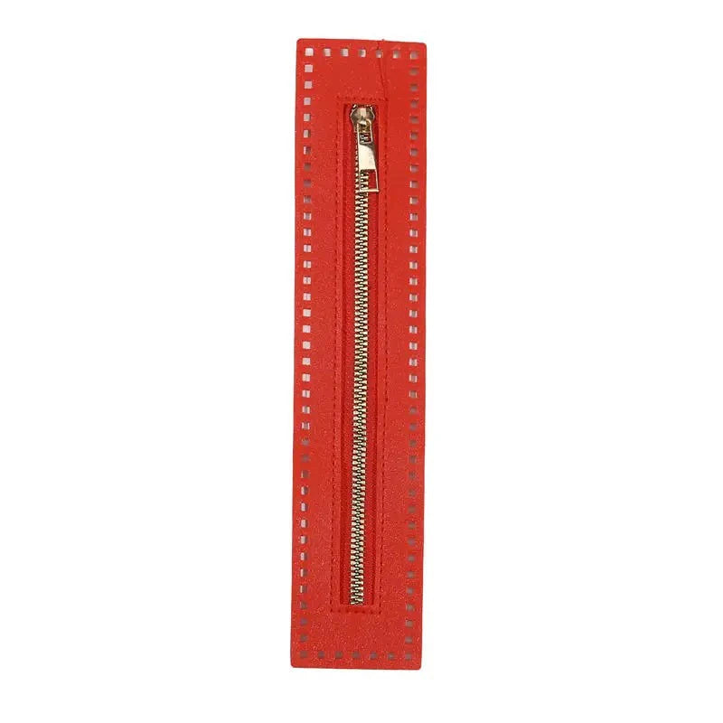 A vertical red leather zipper for handbags and sewing projects.