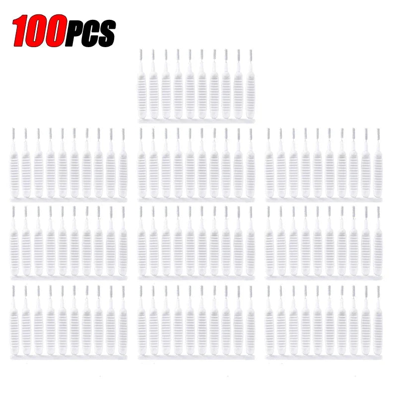 A set of 100 plastic shower cleaning brushes with nozzles for unclogging.
