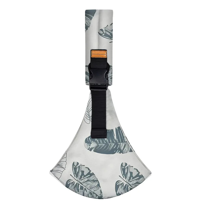 A beige and gray patterned ergonomic baby sling carrier with a black strap and padded hip seat.