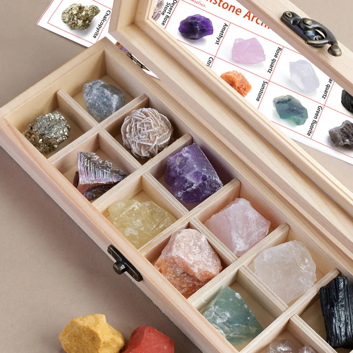 A wooden gift box containing twelve natural amethyst crystal stones and a guide sheet.