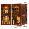A wooden book nook kit featuring an elaborate library scene with detailed architecture and internal LED lighting.