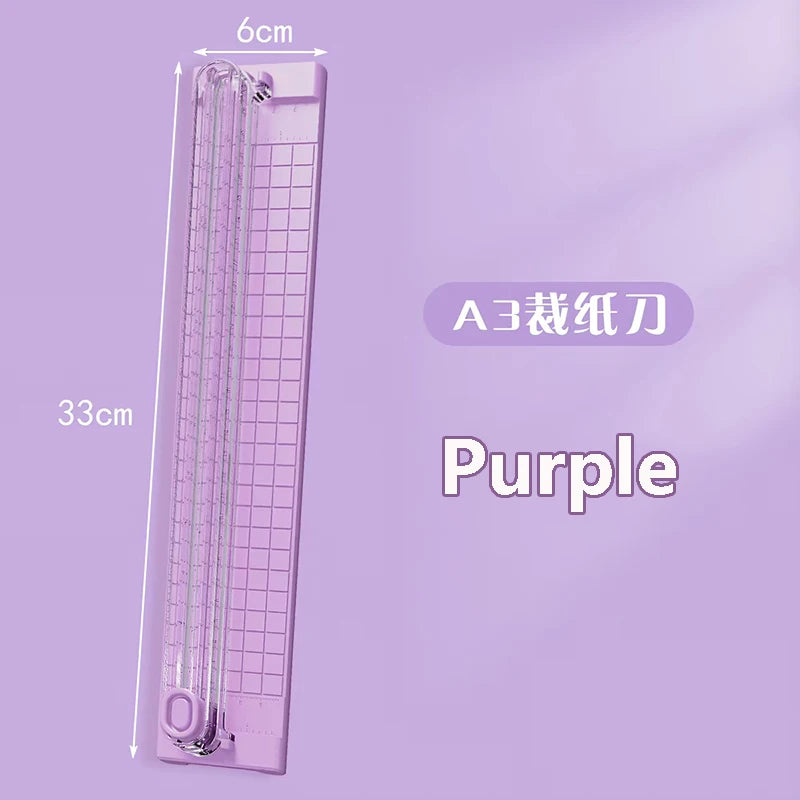 A purple portable A3 paper cutter trimmer with a 6cm length and 33cm height.