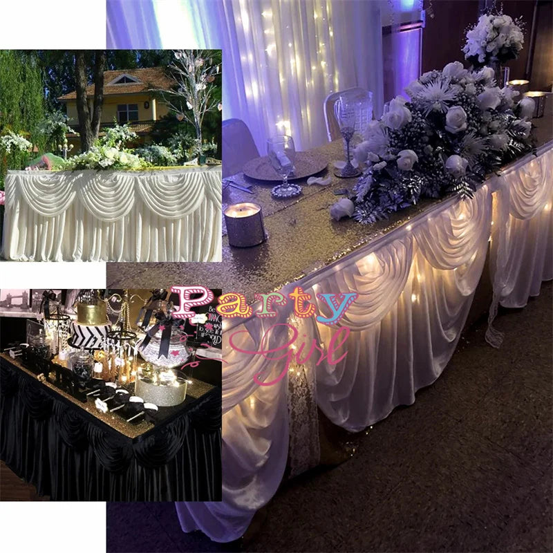Elegant ice silk table skirt with matching top swag draped in white fabric and illuminated lights.