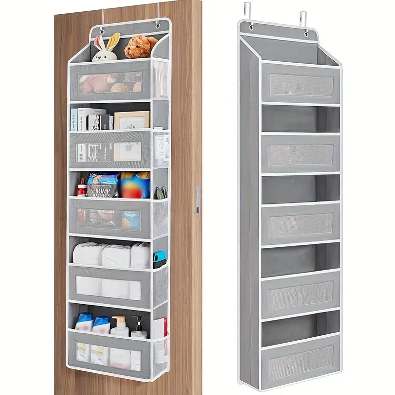A tall, gray hanging storage organizer with five shelves is mounted on a wooden door.