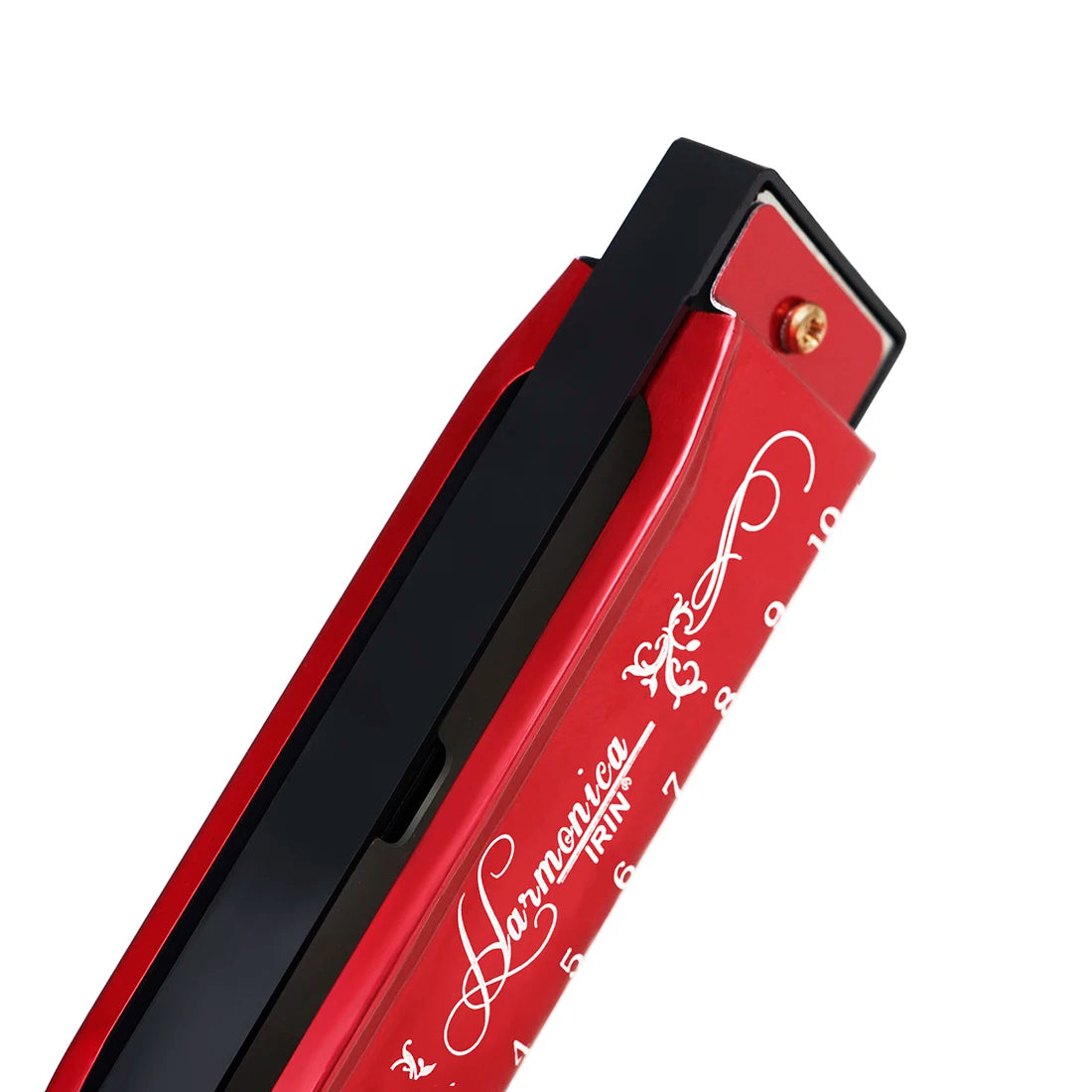 A red and black harmonica with a silver key is shown in a close-up view.